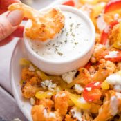 Dipping-Loaded-Buffalo-Cauliflower-Wings-in-Ranch