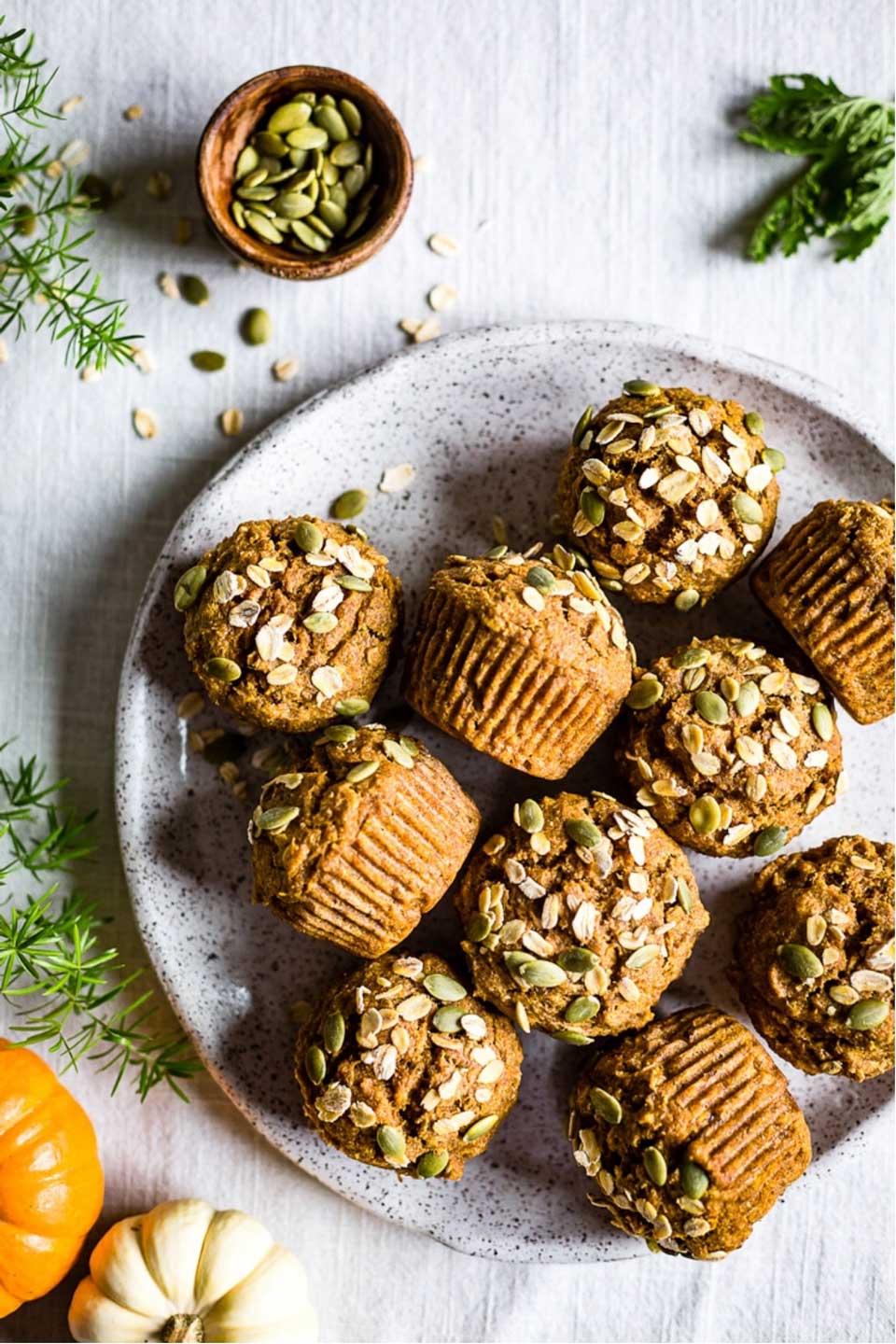 From paleo to gluten free, sugar free to whole grain! No matter what “healthy” means to you, we’ve got pumpkin muffins you’ll love! Unique flavor combos and lots of decadence … but so nutritious, too! These healthy pumpkin muffin recipes are easy to make – whip one up for quick breakfasts or healthy snacks! | pumpkin recipes | pumpkin muffins healthy | gluten free | grain free | paleo | whole wheat | refined sugar free | dairy free | #healthyrecipes #pumpkin #muffins | www.TwoHealthyKitchens.com